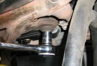 This bolt connects the pipes to the oil pan