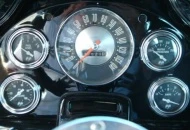 Original cable operated speedo surrounded by Moon Gauges.