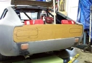 Work began by removing all the tail light parts and panels, and making a cardboard template.
