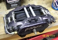 Outlaw 4000 series caliper using 1 3/4" pistons. Later I painted them red.
