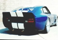 The race car with the OEM tail lights and rear panel.