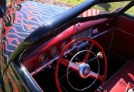 Ever seen this?  The dash was ground/sanded and left swirled.  Candy paint on top.  Cool!