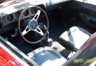  The interior is stock with a rim blow steering wheel added 