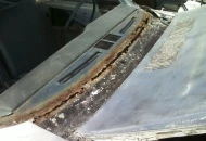 The windshield was only being held in by the chrome mldg. When me removed the glass this is what we found.
