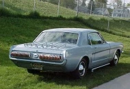 67 cougar taillights and a body colored bumper. 