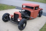1933 Ford pickup, chopped 3", channeled 5", 500 cu. in. Cadillac engine, turbo 400 trans, 2:56 posi rear axle. Bed shortened to 48".